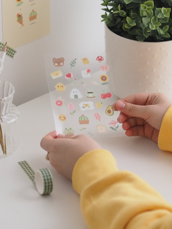 Sticker-Sheet sunny in der Hand gehalten